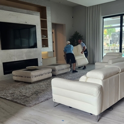 movers moving sofa sectional to place for designer